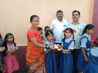 Sweets distributed to school childrens on Dasara